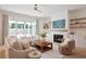Cozy living room with fireplace, neutral furniture, and sliding doors to the outdoors at 2729 Long Avenue Ext., Conway, SC 29526