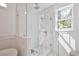 Bright glass shower featuring white tile, rainfall shower head, and natural light at 2729 Long Avenue Ext., Conway, SC 29526