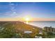 Aerial view of a coastal property with a sunset over the ocean and lush greenery below at 309 Sunset Trail, Myrtle Beach, SC 29577