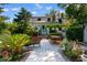 Inviting backyard patio with comfortable seating, dining area, lush landscaping, and pathway at 309 Sunset Trail, Myrtle Beach, SC 29577