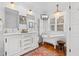 Elegant bathroom with a clawfoot tub, marble vanity, and chandelier, combining vintage charm with modern luxury at 309 Sunset Trail, Myrtle Beach, SC 29577