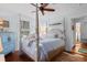 Bedroom with a king bed, 4-poster frame, wood floors and bright natural lighting at 309 Sunset Trail, Myrtle Beach, SC 29577