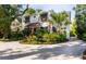 Charming white two-story home with lush landscaping and a welcoming front entrance at 309 Sunset Trail, Myrtle Beach, SC 29577
