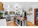 Open kitchen with wood plank ceiling, stainless steel appliances, and lots of counter space at 309 Sunset Trail, Myrtle Beach, SC 29577