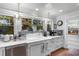 Charming kitchen with custom cabinets, stainless steel appliances, and a farmhouse sink at 309 Sunset Trail, Myrtle Beach, SC 29577
