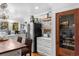 Bright kitchen featuring stainless steel appliances, custom cabinets, and a wood plank ceiling at 309 Sunset Trail, Myrtle Beach, SC 29577