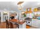 Charming kitchen with a center island, stainless steel appliances, and lots of natural light at 309 Sunset Trail, Myrtle Beach, SC 29577