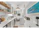 Clean laundry room includes modern washer/dryer, white cabinets and sleek countertops, with an adjacent sink at 309 Sunset Trail, Myrtle Beach, SC 29577