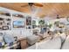 Inviting living room with wood plank ceiling, built-in shelving, and cozy seating arrangement at 309 Sunset Trail, Myrtle Beach, SC 29577