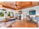 Relaxing living room boasting a wood-paneled ceiling, leather sofa, and an inviting, stylish decor throughout at 309 Sunset Trail, Myrtle Beach, SC 29577
