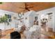 Bright living room with wood plank ceiling, access to stairs, and comfortable seating at 309 Sunset Trail, Myrtle Beach, SC 29577