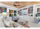 Comfortable living room with wood plank ceiling, built-in shelving, and a view of the exterior at 309 Sunset Trail, Myrtle Beach, SC 29577