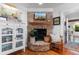 Inviting living room showcasing a brick fireplace with wooden mantel, blending rustic charm with modern comfort at 309 Sunset Trail, Myrtle Beach, SC 29577