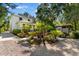 Charming outdoor patio and garden featuring lush landscaping, lighting, and comfortable seating at 309 Sunset Trail, Myrtle Beach, SC 29577