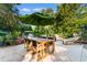 Inviting patio with ample seating under a large umbrella, perfect for outdoor entertaining or relaxation at 309 Sunset Trail, Myrtle Beach, SC 29577