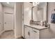 Bathroom featuring a granite countertop vanity with a decorative mirror and a tiled floor at 3091 Viceroy Loop, Little River, SC 29566
