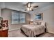 Inviting bedroom with a ceiling fan, natural light and stylish decor, perfect for relaxation at 3091 Viceroy Loop, Little River, SC 29566