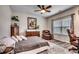 Comfortable bedroom featuring a ceiling fan, large window and wood floors at 3091 Viceroy Loop, Little River, SC 29566
