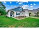 Charming single-Gathering home with manicured lawn, two-car garage, and inviting front porch at 3091 Viceroy Loop, Little River, SC 29566