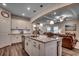 Spacious kitchen with granite countertops, a large island, and an open floor plan view to the living area at 3091 Viceroy Loop, Little River, SC 29566