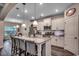 Modern kitchen featuring a granite island with seating, stainless steel appliances, and stylish pendant lighting at 3091 Viceroy Loop, Little River, SC 29566