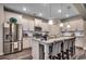 Bright kitchen featuring a large island with seating, stainless steel appliances, and granite countertops at 3091 Viceroy Loop, Little River, SC 29566