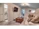 Cozy living area features a TV, coffee table, and comfortable seating with natural light at 3091 Viceroy Loop, Little River, SC 29566