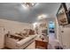 Comfortable living room area with a sofa, coffee table, television, and a view of the bedroom at 3091 Viceroy Loop, Little River, SC 29566