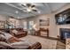 Elegant living room with fireplace, hardwood floors, and an abundance of natural light at 3091 Viceroy Loop, Little River, SC 29566