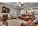 Inviting living room boasts a fireplace, comfortable seating, and lots of natural light at 3091 Viceroy Loop, Little River, SC 29566