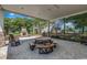 Inviting covered patio with stone fireplace and ample seating, perfect for gathering with friends and Gathering at 3091 Viceroy Loop, Little River, SC 29566