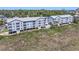 Aerial view showcasing the residential complex with a glimpse of the pool and surrounding greenery at 310 Marsh Pl. # 108, Murrells Inlet, SC 29576