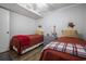 Bedroom featuring two twin beds, wood floors, and nautical decor at 310 Marsh Pl. # 108, Murrells Inlet, SC 29576
