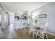 Open-concept living space with dining area, kitchen, and comfortable seating at the breakfast bar at 310 Marsh Pl. # 108, Murrells Inlet, SC 29576