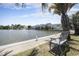 Scenic pond view with a fountain, a bench, and nearby condos at 310 Marsh Pl. # 108, Murrells Inlet, SC 29576