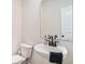 Cozy bathroom featuring a sleek pedestal sink with black faucet and a modern design at 3129 Palma Way, Myrtle Beach, SC 29579