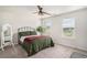 Well-lit bedroom with large windows, ceiling fan, and comfortable bed at 3129 Palma Way, Myrtle Beach, SC 29579
