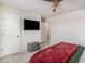 Comfortable bedroom with a ceiling fan and mounted television at 3129 Palma Way, Myrtle Beach, SC 29579