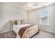 Bright bedroom with a ceiling fan, large window, and neutral decor at 3129 Palma Way, Myrtle Beach, SC 29579