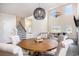 Bright dining area showcases a round table, elegant chairs, and modern lighting fixtures beneath soaring ceilings at 3129 Palma Way, Myrtle Beach, SC 29579