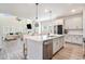 Modern kitchen with white cabinets, quartz countertops, and an open floor plan at 3129 Palma Way, Myrtle Beach, SC 29579