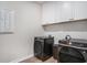 Bright laundry room featuring a washer and dryer, and white cabinets for optimal storage at 3129 Palma Way, Myrtle Beach, SC 29579