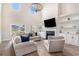 Bright living room with fireplace, built-ins, and large windows offering backyard views at 3129 Palma Way, Myrtle Beach, SC 29579