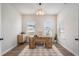 Well-lit home office with a large desk, wood floors, and ample natural light at 3129 Palma Way, Myrtle Beach, SC 29579