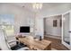 Well-lit home office with a large desk, wood floors, and ample natural light at 3129 Palma Way, Myrtle Beach, SC 29579
