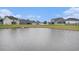 Beautiful pond view with lush greenery and well-maintained landscaping of neighboring homes at 3129 Palma Way, Myrtle Beach, SC 29579