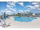 Sparkling community pool with ample lounge chairs, perfect for relaxation and recreation on sunny days at 3129 Palma Way, Myrtle Beach, SC 29579