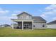 Charming home featuring a screened in porch, perfect for outdoor relaxation and entertaining on a well-maintained lawn at 3129 Palma Way, Myrtle Beach, SC 29579