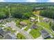 Aerial view of a well-manicured home in a neighborhood with mature trees at 316 Watercress Dr., Longs, SC 29568