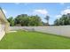 This spacious backyard features a well-maintained lawn and a privacy fence at 316 Watercress Dr., Longs, SC 29568